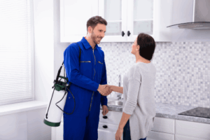 How Often Should Pest Control Come? 1 Pest working shaking hands
