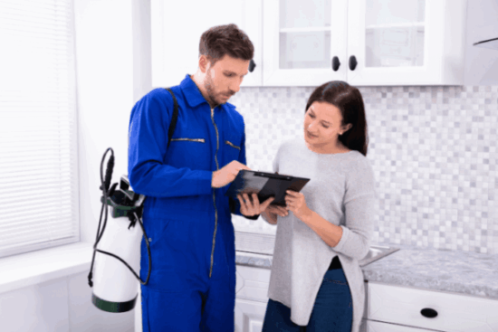 Pest-Control-Worker-Showing-Invoice-Woman Beeline Pest Control Service in Utah